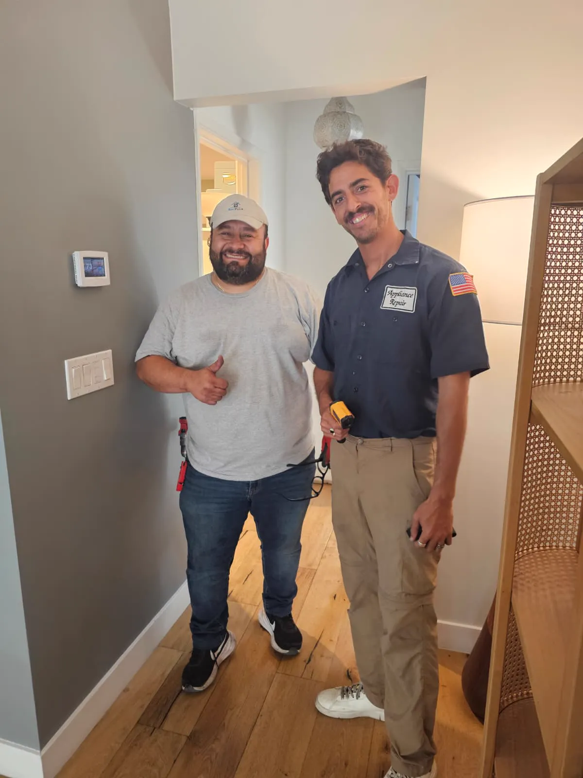 Ben and a technician after finishing a thermostat and HVAC job